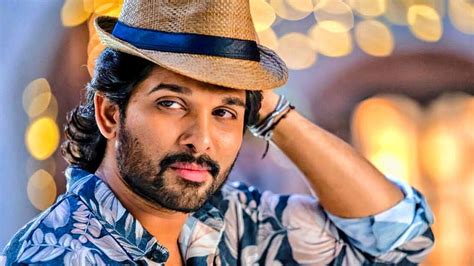 Allu Arjun Is Wearing Blue Flowers Printed Shirt And Brown Cap Allu