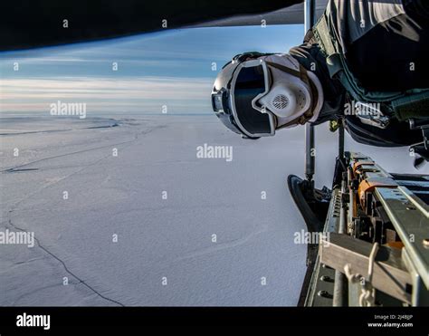 A Naval Special Warfare Jump Master Performs In Flight Duties Before A