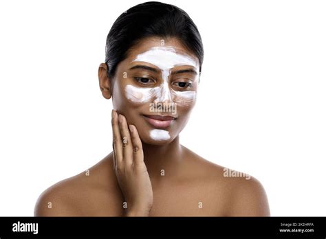 Young indian woman with a cleansing mask applied on her face Stock Photo - Alamy