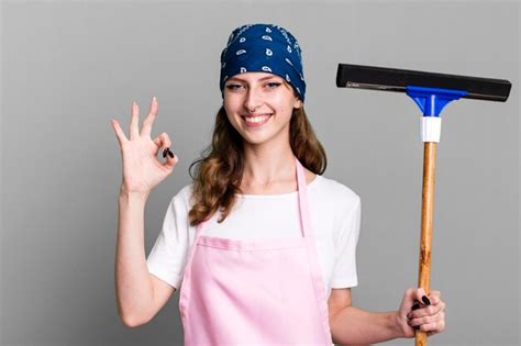 Premium Photo Caucasian Pretty Blonde Woman Housekeeper And Cleaning Windows Concept