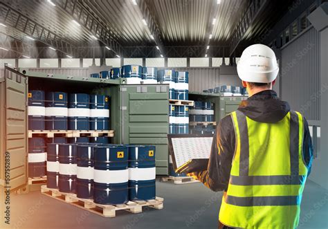 Auditor In Warehouse With Oil Barrels Man With Laptop With Back To