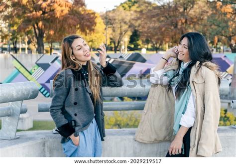 Two Women Friends Talking Happily Leaning Stock Photo 2029219517