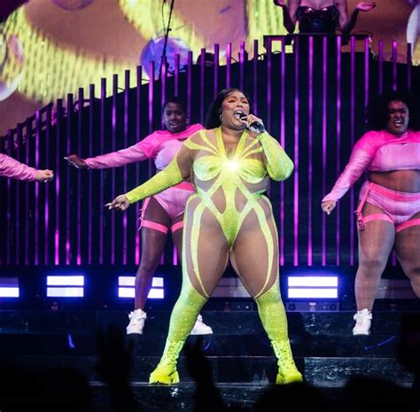 Lizzo Wows Fans As She Slips Into Nude Illusion Skintight Bodysuit On