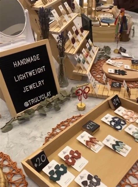 An Assortment Of Handmade Jewelry On Display At A Craft Fair Or Sale