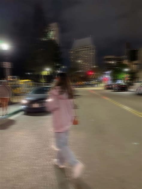 Download Blurry Girl Walking On Road Picture