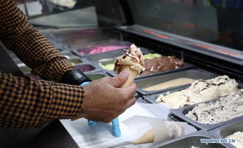 People Enjoy Ice Cream During Hot Day In West Bank City Of Ramallah Xinhua English News Cn