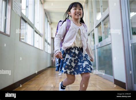 Primary School Children Carrying School Backpacks Stock Photo Alamy
