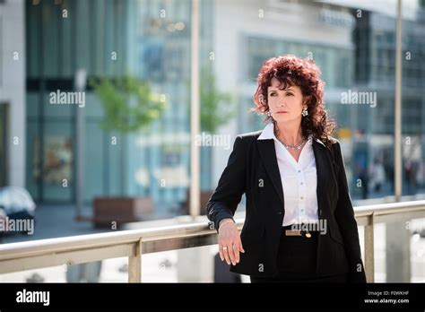Portrait Of Confident Mature Business Woman Outdoor In Modern Street