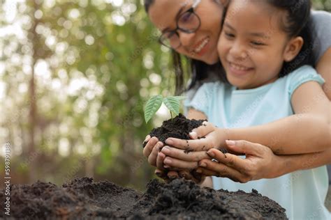 Hands Holding Young Plant With Soilworld Environment Day And