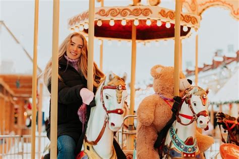 Premium Photo Girl Riding A Carousel With Horses