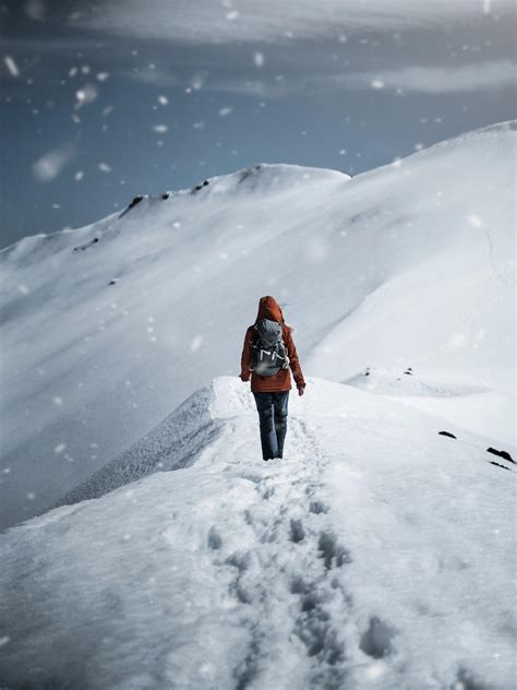 Person Walking On Snow · Free Stock Photo