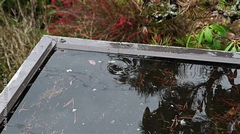 Water Swirling Down A Carport Drain And Clearing Storm Water From A