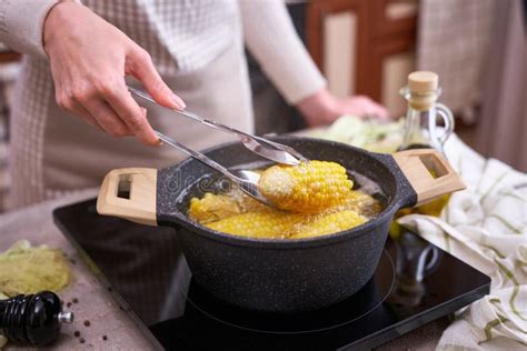 Cooking Corn Cob in a Pot of Boiling Water with Bubbles Stock Photo ...