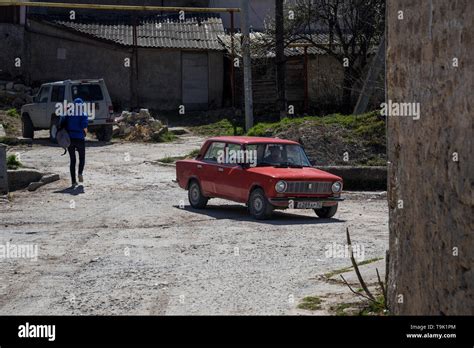 Bakhchysarai, Republic of Crimea - April 1, 2019: Red sedan car VAZ ...