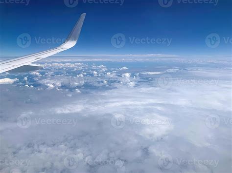 Airplane Window View on Clouds 1 10134553 Stock Photo at Vecteezy