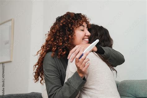 Gay Female Fertility Lesbian Couple Celebrating With Pregnancy Test At Home Soft Focus On