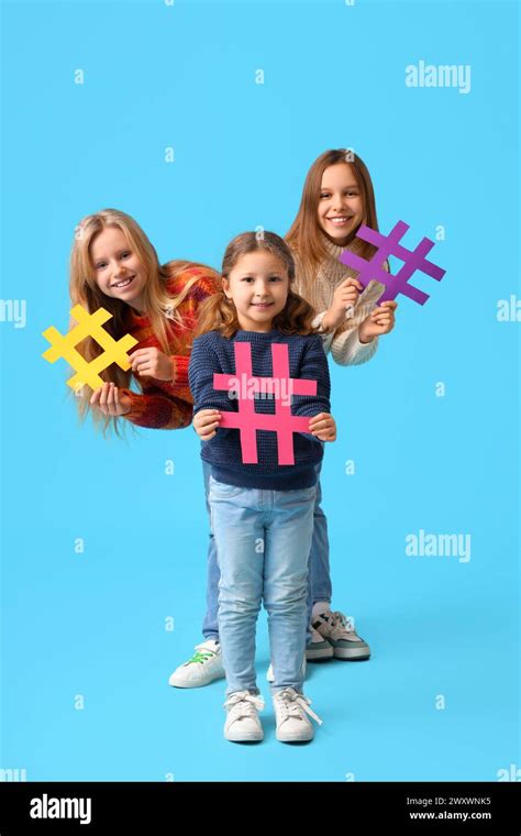 Cute Girls With Hashtags On Blue Background Stock Photo Alamy