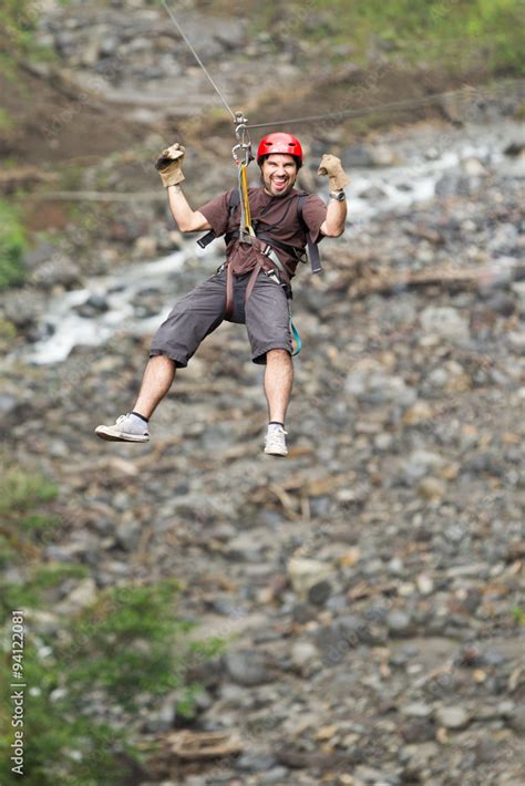 zipline zip line adult man zipline adventure in ecuadorian rainforest ...