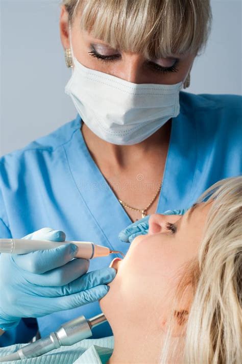 Dentist with Patient, Dental Calculus Removal Stock Photo - Image of ...