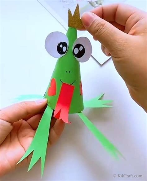 someone is making a frog out of paper