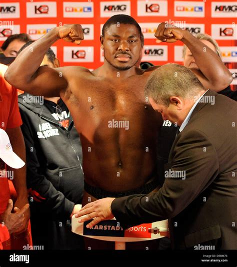 Nigerian Heavyweight Boxer Samuel Peter Poses On The Scales At The