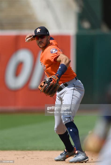 Carlos Correa Of The Houston Astros Looks To Throw The Runner Out