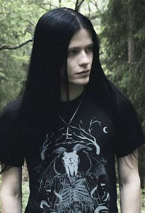 A Man With Long Black Hair Wearing A T Shirt