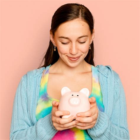 Free Photo Beautiful Woman Holding Piggy Bank For Financial Savings