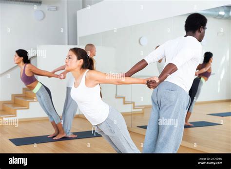 Couples Yoga Classes In Modern Fitness Center Stock Photo Alamy