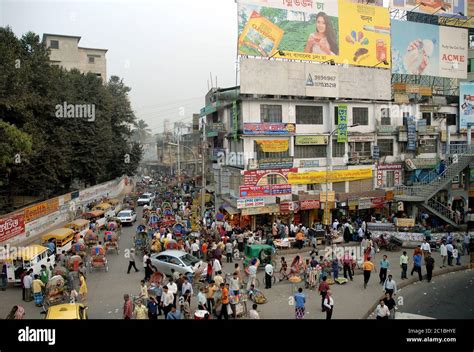 A Crowd Of People And Transport On The Street In The Farmgate Area Of