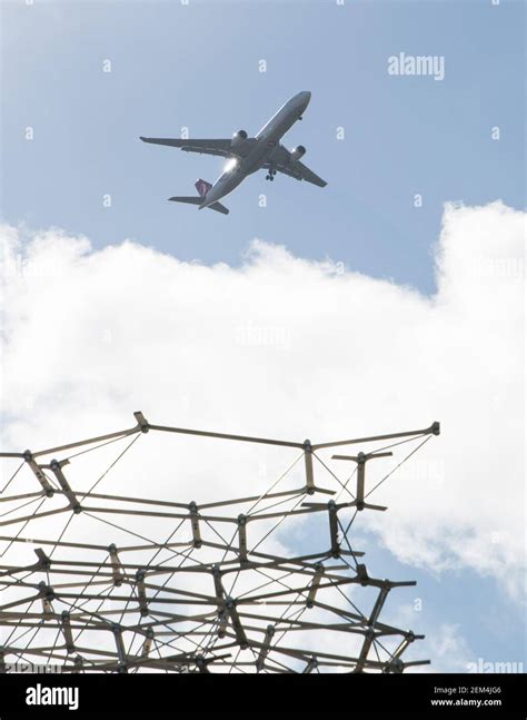 A Detail Of The Hive Pavilion With A Plane In The Background The Hive