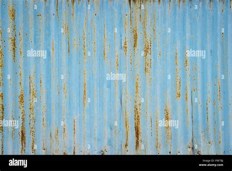 Old Blue Rusted Metal Wall With Texture As Clear Background Stock Photo