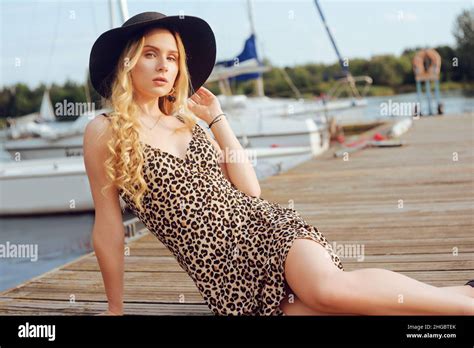 Girl On Background Of Yachts Sailing Boats Smiling Looking At The Camera Beautiful Blonde Is