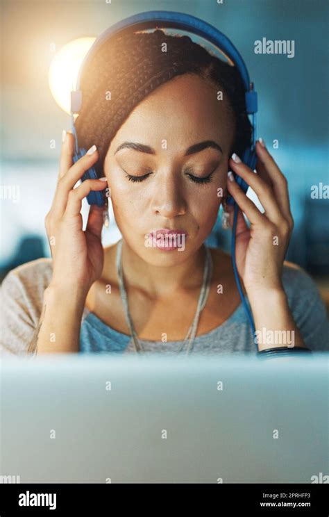 Music Gets Her In The Zone A Young Woman Listening To Music While