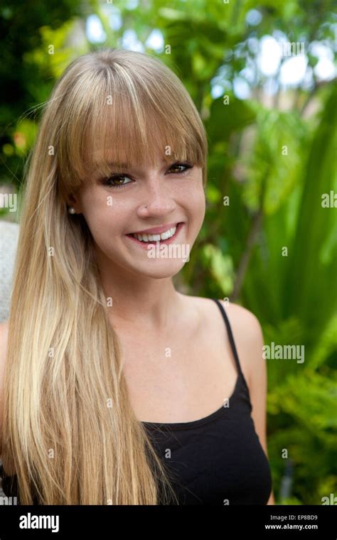 Portrait Of Beautiful Blond Girl In Her Garden Stock Photo Alamy