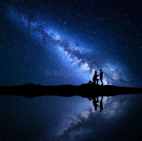 Milky Way Night Starry Sky With Silhouettes Of A Couple Stock Image Image Of Proposal Milky