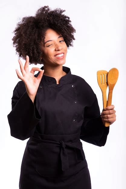 Premium Photo Studio Shot Of A Female Chef With A Wooden Spoon