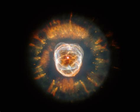 The Eskimo Nebula NGC 2392 Resembling A Person S Head Surrounded By