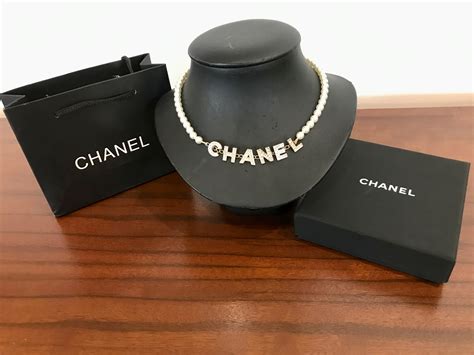 An Authentic Chanel Word Pearl Necklace In Original Box Artedeco