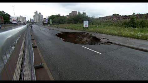 Giant Sinkhole Causes Mayhem In Manchester Uk Fri 14 08 2015 Must