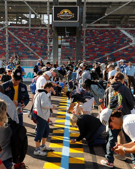 Racing fans at Homestead Raceway celebrate a thrilling photo finish 11