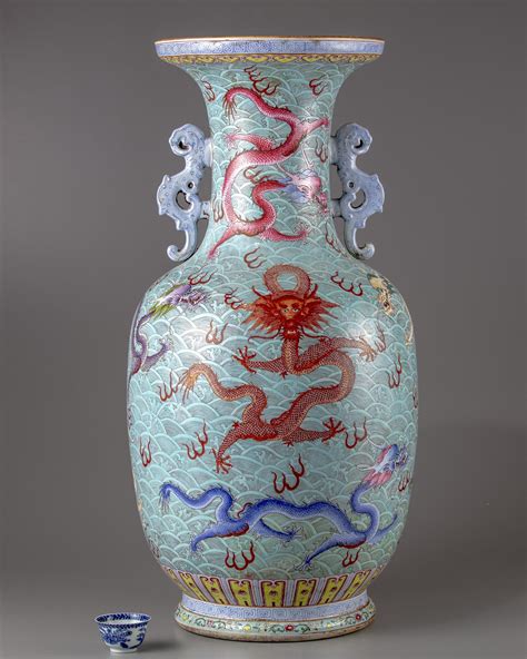 A Chinese Blue Ground Famille Rose Dragons Vase