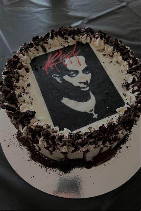 A Cake That Has Been Decorated With The Image Of A Man S Face On It