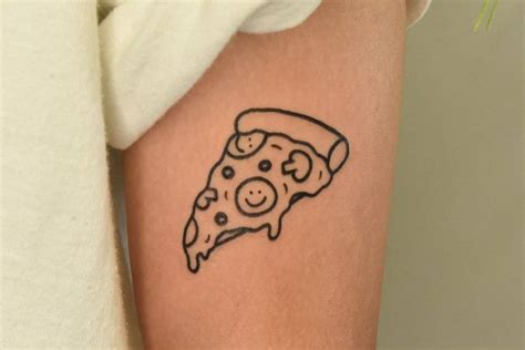 Pizza Slice Tattoo Located On The Upper Arm