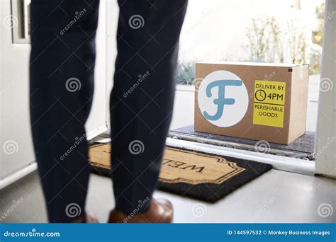 Close Up Of Man Opening Front Door To Fresh Food Home Delivery In