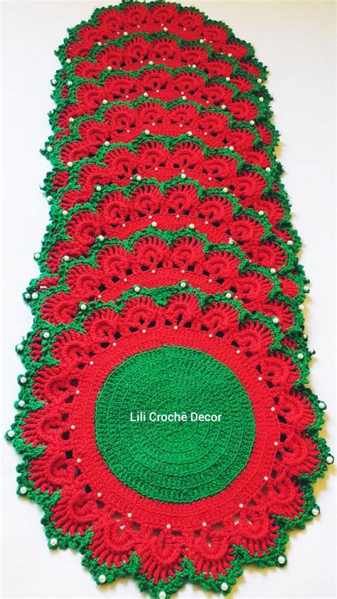 Red And Green Crocheted Placemats On White Surface