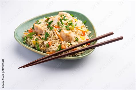 schezwan chicken fried rice Stock Photo | Adobe Stock