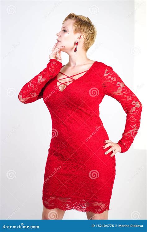 Fashion Female In Red Lace Dress Standing Alone Plus Size Blonde Woman