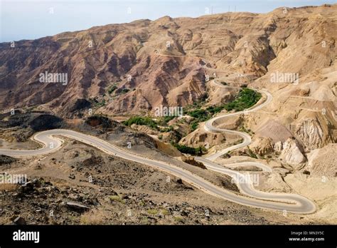 Aerial View Of Country Road Winding Through The Jordanian Desert