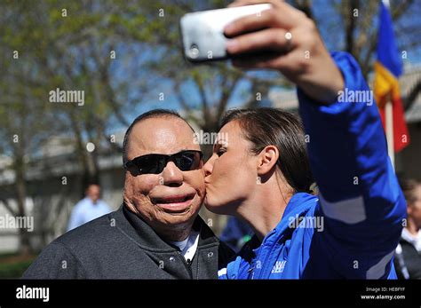 U.S. Air Force Tech. Sgt. Israel Del Toro, left, receives a kiss from retired USAF Staff Sgt ...